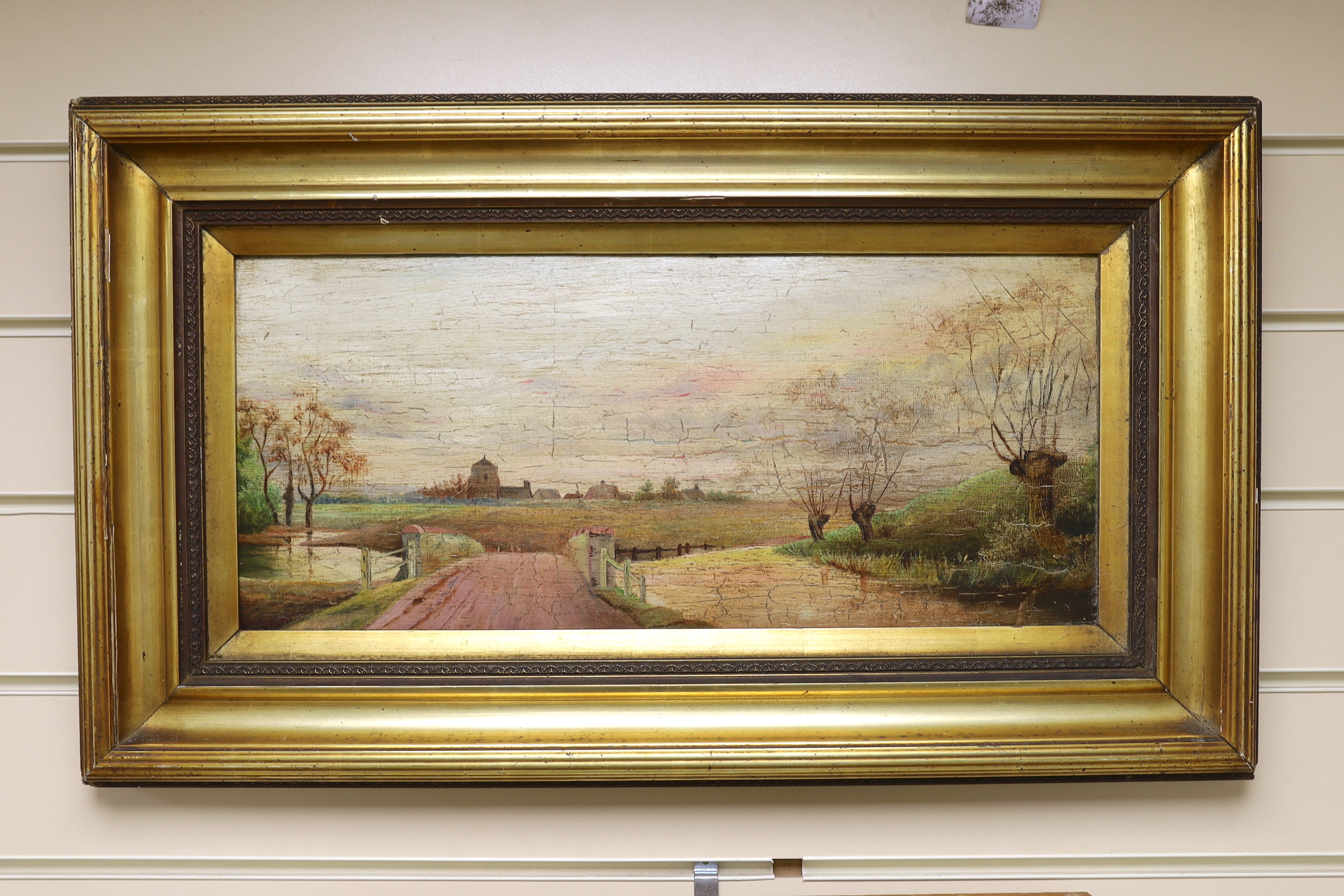 20th century English school, oil on board, Bridge over a stream, 20 x 46cm